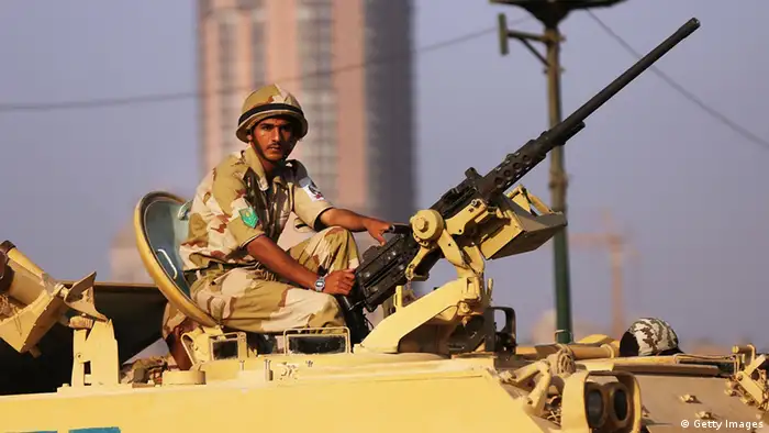 CAIRO, EGYPT - JULY 08: Following a day of massive rallies against the ousted Egyptian President and an early morning shooting of pro Mohamed Morsi supporters outside a Presidential Guard barracks, members of the Egyptian military man an armoured vehicle as they guard a bridge near Tahrir Square on July 8, 2013 in Cairo, Egypt. Egypt continues to be in a state of political paralysis with scores of people having been killed and many injured in recent days as the Egyptian military attempts to restore order across the country following their ousting of Morsi. (Photo by Spencer Platt/Getty Images)