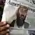 A man reads a paper "The Nation" about the killing of bin Laden in May 2011. (Photo: EPA/ARSHAD ARBAB +++(c) dpa - Bildfunk+++)