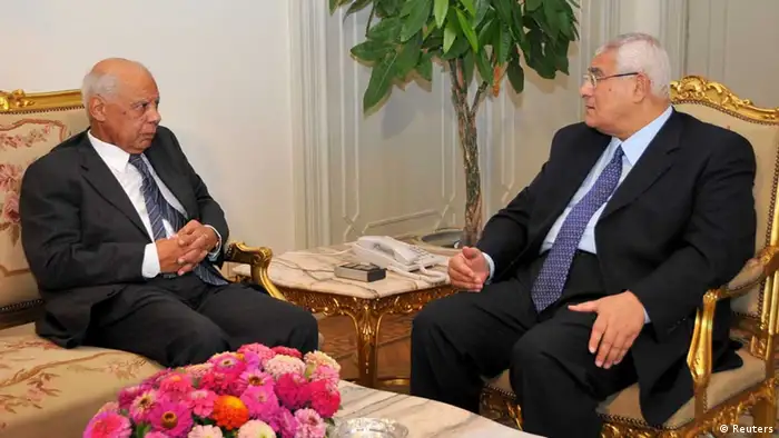 Egypt's interim President Adli Mansour (R) meets with Egypt's former Finance Minister Hazem el-Beblawi at El-Thadiya presidential palace in Cairo July 9, 2013 in this picture provided by the Egyptian Presidency. The interim president on Tuesday named liberal economist el-Beblawi as prime minister in a transitional government, as the authorities sought to steer the country to new parliamentary and presidential elections. REUTERS/Egyptian Presidency/Handout via Reuters (EGYPT - Tags: POLITICS CIVIL UNREST) ATTENTION EDITORS - THIS IMAGE WAS PROVIDED BY A THIRD PARTY. FOR EDITORIAL USE ONLY. NOT FOR SALE FOR MARKETING OR ADVERTISING CAMPAIGNS. THIS PICTURE IS DISTRIBUTED EXACTLY AS RECEIVED BY REUTERS, AS A SERVICE TO CLIENTS. NO SALES. NO ARCHIVES