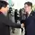 Head of the South Korean working-level delegation Suh Ho (R) shakes hands with his North Korean counterpart Park Chol-su upon Park's arrival at the Kaesong Industrial District Management Committee in Kaesong July 10, 2013. South and North Korea began working-level talks on Wednesday to discuss the normalisation of operations at the jointly run industrial park, including the resumption of facilities inspections, according to local media. REUTERS/Korea Pool/Yonhap (NORTH KOREA - Tags: POLITICS BUSINESS) ATTENTION EDITORS – THIS IMAGE WAS PROVIDED BY A THIRD PARTY. NO SALES. NO ARCHIVES. FOR EDITORIAL USE ONLY. NOT FOR SALE FOR MARKETING OR ADVERTISING CAMPAIGNS. SOUTH KOREA OUT. NO COMMERCIAL OR EDITORIAL SALES IN SOUTH KOREA. THIS PICTURE IS DISTRIBUTED EXACTLY AS RECEIVED BY REUTERS, AS A SERVICE TO CLIENTS
