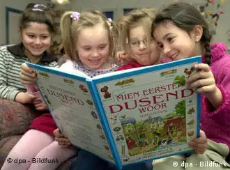 Children read a book together