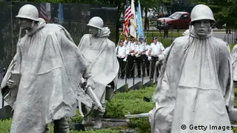 WASHINGTON - JULY 27: Korean War Veterans Color Guards march on the ground of the Korean War Veterans Memorial during a ceremony at the Korean War Veterans Memorial July 27, 20004 in Washington, DC. Korean War Veterans Armistice Committee hosted a ceremony to commemorate the 51st anniversary of the Korean War and the 9th anniversary of the Korean War Veterans Memorial. (Photo by Alex Wong/Getty Images)