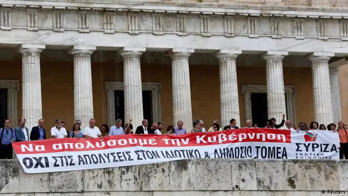 Parliamentarians of the anti-bailout radical leftist SYRIZA party hold a banner in front of the parliament in Athens, July, 16, 2013, during a 24-hour general strike in Greece. The banner reads Let's fire the government. No lay-offs in the state and private sector. REUTERS/Yannis Behrakis (GREECE - Tags: POLITICS BUSINESS CIVIL UNREST)