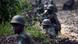 Congolese Army soldiers man a foward position in Kanyarucinya, some 12 kms from Goma, in the east of the Democratic Republic of the Congo on July 16, 2013. The army in the Democratic Republic of Congo on July 16 pursued an offensive against rebels of the M23 movement to protect the North Kivu provincial capital of Goma. M23, a movement launched by Tutsi defectors from the army who accuse the Kinshasa government of reneging on a 2009 peace deal, last year occupied Goma for 10 days before pulling out under international pressure. AFP PHOTO / PHIL MOORE (Photo credit should read PHIL MOORE/AFP/Getty Images) Congolese Army soldiers man a foward position in Kanyarucinya, some 12 kms from Goma, in the east of the Democratic Republic of the Congo on July 16, 2013. The army in the Democratic Republic of Congo on July 16 pursued an offensive against rebels of the M23 movement to protect the North Kivu provincial capital of Goma. M23, a movement launched by Tutsi defectors from the army who accuse the Kinshasa government of reneging on a 2009 peace deal, last year occupied Goma for 10 days before pulling out under international pressure. AFP PHOTO / PHIL MOORE (Photo credit should read PHIL MOORE/AFP/Getty Images)