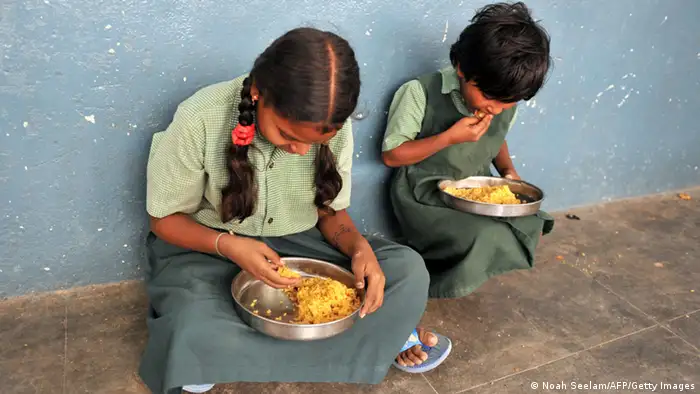 Indian children eat their mid-day meal at a Government High School in Hyderabad, on January 10, 2012. Levels of under-nutrition in the country were 'unacceptably high' despite impressive GDP growth, Prime Minister Manmohan Singh said on January 10, 2012 and added that the problem of malnutrition was a 'national shame'. AFP PHOTO / Noah SEELAM (Photo credit should read NOAH SEELAM/AFP/Getty Images)