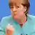 German Chancellor Angela Merkel gestures as she address media during a news conference at Bundespressekonferenz in Berlin July 19, 2013. REUTERS/Tobias Schwarz (GERMANY - Tags: POLITICS)
