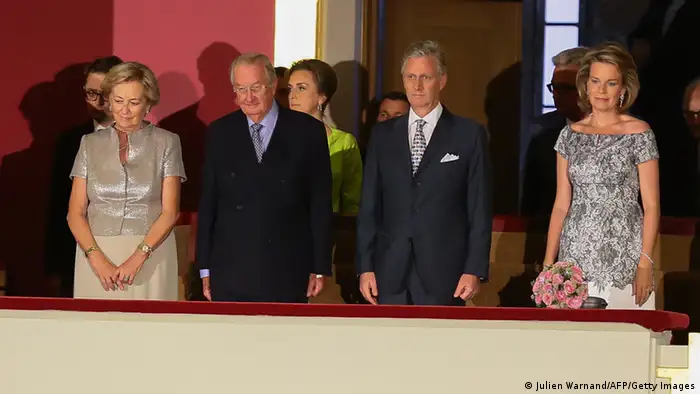 (From L) Princess Astrid, Prince Lorenz, Queen Paola, King Albert II, Crown Prince Philippe, Princess Mathilde and Queen Fabiola of Belgium attend the concert 'Prelude to the National Day' at the Palace of Fine Arts in Brussels, on July 20, 2013. King Albert II abdicates on July 21 in favour of son Philippe in sober weekend celebrations clouded by doubts over the new king's political dexterity and shorn of foreign royals. AFP PHOTO / BELGA PHOTO / POOL / JULIEN WARNAND --BELGIUM OUT-- (Photo credit should read JULIEN WARNAND/AFP/Getty Images)