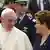 Pope Francis walks with Brazil's President Dilma Rousseff upon arrival at Antonio Carlos Jobim International Airport in Rio de Janeiro, July 22, 2013. Pope Francis touched down in Rio de Janeiro on Monday, starting his first foreign trip as pontiff and a weeklong series of events expected to attract more than a million people to a gathering of young faithful in Brazil, home to the world's largest Roman Catholic population. REUTERS/Pilar Olivares (BRAZIL - Tags: RELIGION POLITICS)