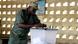 A Togolese soldier casts his ballot during the early voting for the country's parliamentary elections at the RIT camp in Lome July 22, 2013. Candidates representing various political parties in Togo are taking their campaigns from door to door ahead of parliamentary elections planned for July 25. The West African nation is gearing up to hold the twice delayed polls, following an agreement between major opposition coalitions and the ruling party. REUTERS/Noel Kokou Tadegnon / Eingestellt von wa A Togolese soldier casts his ballot during the early voting for the country's parliamentary elections at the RIT camp in Lome July 22, 2013. Candidates representing various political parties in Togo are taking their campaigns from door to door ahead of parliamentary elections planned for July 25. The West African nation is gearing up to hold the twice delayed polls, following an agreement between major opposition coalitions and the ruling party. REUTERS/Noel Kokou Tadegnon / Eingestellt von wa