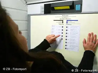 A woman reviews the ballot in 2002 German elections