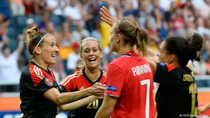 Germany's forward Anja Mittag (L) celebrates with her teammates after scoring during the UEFA Women's European Championship Euro 2013 final Germany vs Norway on July 28, 2013 in Solna, Sweden. AFP PHOTO/JONATHAN NACKSTRAND (Photo credit should read JONATHAN NACKSTRAND/AFP/Getty Images)