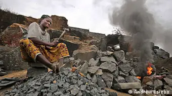 Liberian Woman crushing rocks (photo: Wade C.L. Williams).