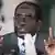 Zimbabwe's President Robert Mugabe at a microphone (REUTERS/Philimon Bulawayo)