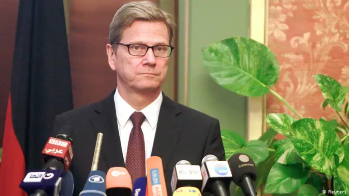 German Foreign Minister Guido Westerwelle looks on during a news conference with Egypt's interim Foreign Minister Nabil Fahmy in Cairo August 1, 2013. Germany urged Egypt to avoid the appearance of selective justice on Thursday amid a crackdown on deposed President Mohamed Mursi's Muslim Brotherhood, which remained defiantly dug in at a protest camp the police have orders to remove. REUTERS/Mohamed Abd El Ghany (EGYPT - Tags: POLITICS CIVIL UNREST)