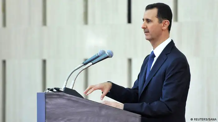 Syria's President Bashar al-Assad delivers a speech while attending an Iftar, or breaking fast session, during the Muslim month of Ramadan in Damascus in this handout photograph distributed by Syria's national news agency SANA on August 4, 2013. Other attendees include political party representatives, politicians, independent figures, Muslim and Christian religious figures, representatives of unions and syndicates, and civil society figures. REUTERS/SANA/Handout via Reuters (SYRIA - Tags: POLITICS RELIGION) ATTENTION EDITORS - THIS IMAGE WAS PROVIDED BY A THIRD PARTY. FOR EDITORIAL USE ONLY. NOT FOR SALE FOR MARKETING OR ADVERTISING CAMPAIGNS. THIS PICTURE IS DISTRIBUTED EXACTLY AS RECEIVED BY REUTERS, AS A SERVICE TO CLIENTS FREI FÜR SOCIAL MEDIA