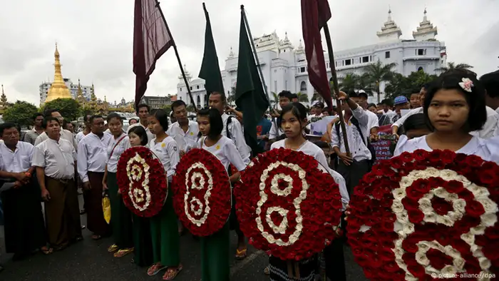epa03816436 Young students hold a wreath during the rally to mark the 25th anniversary of 8888 uprising in Yangon, Myanmar, 08 August 2013. The 08 August 1988, also known as '8888 Uprising' marked the start of protests by students in Yangon that would soon spread through the country. The demonstrations were aimed at the then ruling Burma Socialist Programme Party regime as a one-party state, headed by General Ne Win. The protests ended in September the same year after a military coup by the State Law and Order Restoration Council (SLORC). EPA/NYEIN CHAN NAING