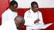 Doctors at Equitorial Guinea looking at the file of a patient. Doctors at Equitorial Guinea looking at the file of a patient.