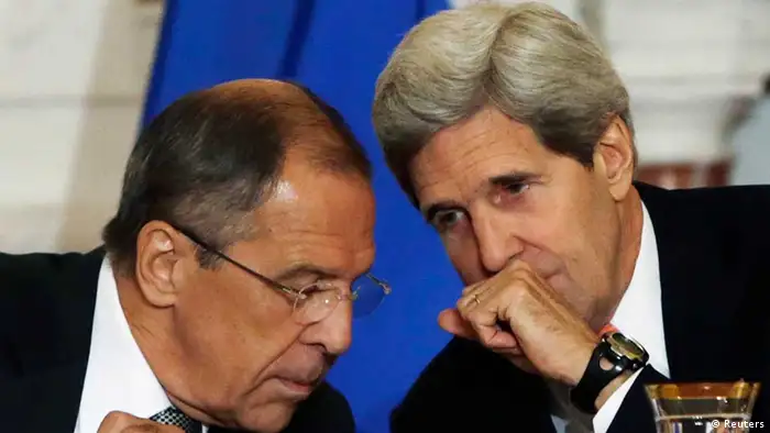 U.S. Secretary of State John Kerry (R) and Russian Foreign Minister Sergey Lavrov confer during a press briefing at the State Department in Washington before a day of talks August 9, 2013. U.S. and Russian officials will seek to maintain a working relationship when they meet in Washington on Friday even though the political mood between the two countries has hit one of its lowest points since the end of the Cold War. REUTERS/Gary Cameron (UNITED STATES - Tags: POLITICS)