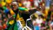 Usain Bolt of Jamaica poses with his national flag after winning the men's 100 metres final during the IAAF World Athletics Championships at the Luzhniki stadium in Moscow August 11, 2013. REUTERS/Kai Pfaffenbach (RUSSIA - Tags: SPORT ATHLETICS) Usain Bolt of Jamaica poses with his national flag after winning the men's 100 metres final during the IAAF World Athletics Championships at the Luzhniki stadium in Moscow August 11, 2013. REUTERS/Kai Pfaffenbach (RUSSIA - Tags: SPORT ATHLETICS)