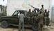 Militiamen in truck with weapons in Mogadishu Militiamen in truck with weapons in Mogadishu
