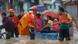 epa03831391 Filipino rescuers use a raft to evacuate residents from a flooded community near a swelling river in Marikina City, east of Manila, Philippines, 20 August 2013. Seven people were killed and more than 130,000 displaced in floods that crippled the Philippine capital for the second day on 20 August, disaster relief officials said. More than half of Manila was flooded, with the murky waters reaching as high as 2 metres in some areas, according to the National Disaster Risk Reduction and Management Council. EPA/ROLEX DELA PENA epa03831391 Filipino rescuers use a raft to evacuate residents from a flooded community near a swelling river in Marikina City, east of Manila, Philippines, 20 August 2013. Seven people were killed and more than 130,000 displaced in floods that crippled the Philippine capital for the second day on 20 August, disaster relief officials said. More than half of Manila was flooded, with the murky waters reaching as high as 2 metres in some areas, according to the National Disaster Risk Reduction and Management Council. EPA/ROLEX DELA PENA