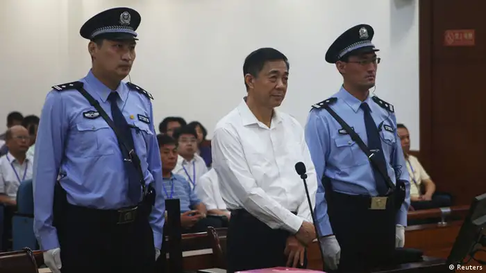Disgraced Chinese politician Bo Xilai stands trial inside the court in Jinan, Shandong province August 22, 2013, in this photo released by Jinan Intermediate People's Court. Fallen Chinese politician Bo appeared in public for the first time in more than a year on Thursday to face trial in eastern China, the final chapter of the country's most politically charged case in more than three decades. REUTERS/Jinan Intermediate People's Court/Handout via Reuters (CHINA - Tags: POLITICS CRIME LAW TPX IMAGES OF THE DAY) ATTENTION EDITORS - THIS IMAGE WAS PROVIDED BY A THIRD PARTY. FOR EDITORIAL USE ONLY. NOT FOR SALE FOR MARKETING OR ADVERTISING CAMPAIGNS