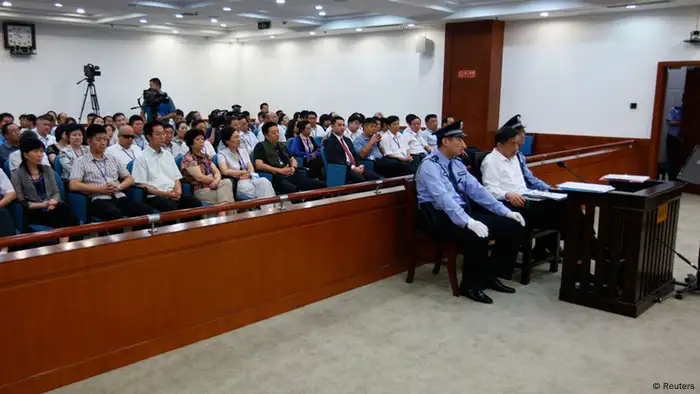 Disgraced Chinese politician Bo Xilai stands trial inside the court in Jinan, Shandong province August 22, 2013, in this photo released by Jinan Intermediate People's Court. Fallen Chinese politician Bo appeared in public for the first time in more than a year on Thursday to face trial in eastern China, the final chapter of the country's most politically charged case in more than three decades. REUTERS/Jinan Intermediate People's Court/Handout via Reuters (CHINA - Tags: CRIME LAW POLITICS) ATTENTION EDITORS - THIS IMAGE WAS PROVIDED BY A THIRD PARTY. FOR EDITORIAL USE ONLY. NOT FOR SALE FOR MARKETING OR ADVERTISING CAMPAIGNS