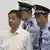 Bo Xilai (C), former Communist Party chief of the southwestern city of Chongqing, is escorted into court by two police officers during his trial in Jinan, Shandong province, August 22, 2013, in this still image taken from China Central Television (CCTV). Fallen Chinese politician Bo Xilai denied one of the bribery charges against him on Thursday as he appeared in public for the first time in more than a year to face China's most political trial in over three decades. REUTERS/China Central Television (CCTV) via Reuters TV (CHINA - Tags: CRIME LAW POLITICS) ATTENTION EDITORS - THIS IMAGE WAS PROVIDED BY A THIRD PARTY. FOR EDITORIAL USE ONLY. NOT FOR SALE FOR MARKETING OR ADVERTISING CAMPAIGNS. NO ARCHIVES. NO SALES. THIS PICTURE IS DISTRIBUTED EXACTLY AS RECEIVED BY REUTERS, AS A SERVICE TO CLIENTS.CHINA OUT. NO COMMERCIAL OR EDITORIAL SALES IN CHINA