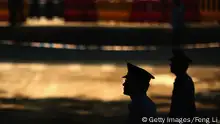 JINAN, CHINA - AUGUST 22: Chinese policemen guard outside the Jinan Intermediate People's Court on August 22, 2013 in Jinan, China. Former Chinese politician Bo Xilai is standing trial on charges of bribery, corruption and abuse of power. Bo Xilai made global headlines last year when his wife Gu Kailai was charged and convicted of murdering British businessman Neil Heywood. (Photo by Feng Li/Getty Images)