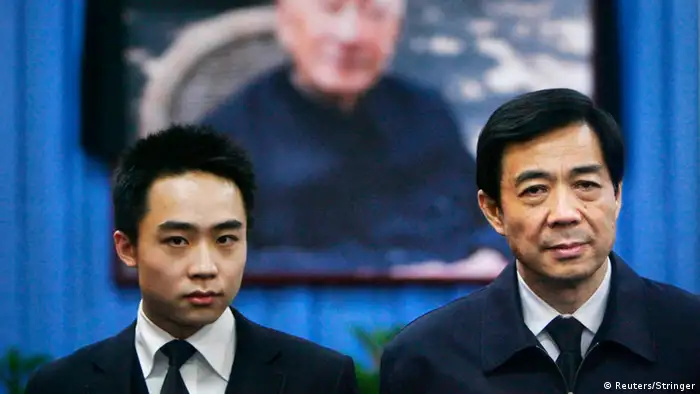 China's then Chongqing Municipality Communist Party Secretary Bo Xilai (R) and his son Bo Guagua stand in front of a picture of his father Bo Yibo, former vice-chairman of the Central Advisory Commission of the Communist Party of China, at a mourning hall in Beijing in this January 18, 2007 file photo. Fallen Chinese politician Bo appeared in public for the first time in more than a year on August 22, 2013 to face trial in eastern China, the final chapter of the country's most politically charged case in more than three decades. REUTERS/Stringer (CHINA - Tags: POLITICS CRIME LAW) CHINA OUT. NO COMMERCIAL OR EDITORIAL SALES IN CHINA