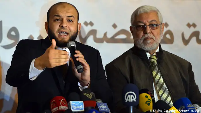 Egyptian media representative of the Muslim brotherhoods group Ahmed Aref (L) speaks next to the party's secretary general Mahmud Hussein during a press conference in Cairo held by the Muslim Brotherhood on March 21, 2013, as opposition activists planned a march on the building where they have previously clashed with the Islamists. The Brotherhood has seen about 30 of its offices across the country attacked in widespread protests against Egypt's President Mohamed Morsi, the Islamists' successful candidate in last June's election. AFP PHOTO / KHALED DESOUKI (Photo credit should read KHALED DESOUKI/AFP/Getty Images)