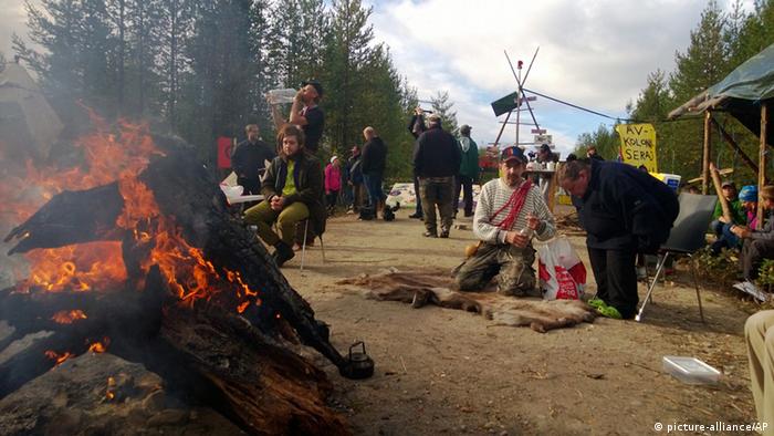 Environmental activists gather near the site of a proposed iron ore mine in Jokkmokk, Sweden (2013)