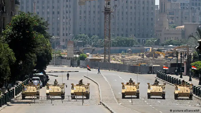 Egyptian army soldiers in armored vehicles block Tahrir Square in Cairo, Egypt, during mass protests Friday, Aug. 23, 2013. Egyptian security and military forces deployed Friday around Cairo, closing off traffic in some major thoroughfares and in the city center as hundreds of supporters of ousted President Mohammed Morsi took to the streets demanding his return to office.(AP Photo/Amr Nabil)