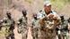 A German soldier with a group of Malian army trainees A German soldier with a group of Malian army trainees