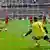 Nuremberg's keeper Raphael Schaefer saves the penalty from Bayern Munich's Austrian midfielder David Alaba