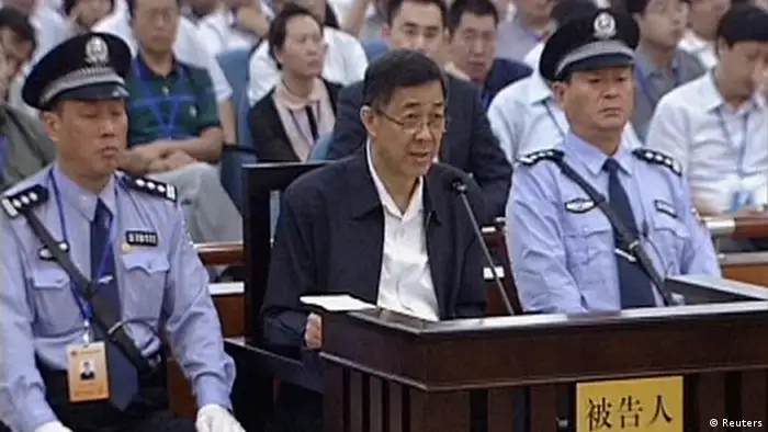Ousted Chinese politician Bo Xilai speaks in court on the third day of his trial in Jinan, Shandong Province, in this still image taken from video shot on August 24, 2013. Bo Xilai accepted responsibility for 5 million yuan ($817,000) in funds he is accused of embezzling which ended up in his wife's bank account, saying he had let his attention wander, in testimony read out in court on Saturday. Bo, once a rising star in China's leadership, is facing charges of corruption, bribery and abuse of power. REUTERS/CCTV via Reuters TV (CHINA - Tags: POLITICS CRIME LAW IMAGES OF THE DAY) ATTENTION EDITORS � THIS IMAGE WAS PROVIDED BY A THIRD PARTY. NO SALES. NO ARCHIVES. FOR EDITORIAL USE ONLY. NOT FOR SALE FOR MARKETING OR ADVERTISING CAMPAIGNS. CHINA OUT. NO COMMERCIAL OR EDITORIAL SALES IN CHINA. THIS PICTURE IS DISTRIBUTED EXACTLY AS RECEIVED BY REUTERS, AS A SERVICE TO CLIENTS