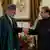 Afghan President Hamid Karzai (R) shakes hands with Pakistan's Prime Minister Nawaz Sharif at the prime minister's residence in Islamabad in August. Photo: Reuters
