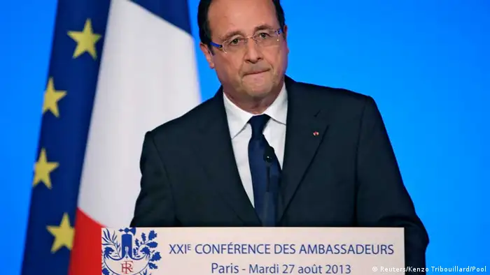 France's President Francois Hollande reacts as he delivers a speech during the annual Conference of Ambassadors at the Elysee Palace in Paris August 27, 2013. President Hollande said on Tuesday that France stood ready to punish the perpetrators of a chemical attack in Damascus last week and would increase its military support to the Syrian opposition. REUTERS/Kenzo Tribouillard/Pool (FRANCE - Tags: POLITICS)