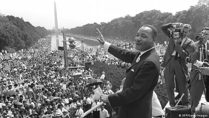 WASHINGTON, UNITED STATES: The civil rights leader Martin Luther KIng (C) waves to supporters 28 August 1963 on the Mall in Washington DC (Washington Monument in background) during the 'March on Washington'. King said the march was 'the greatest demonstration of freedom in the history of the United States.' Martin Luther King was assassinated on 04 April 1968 in Memphis, Tennessee. James Earl Ray confessed to shooting King and was sentenced to 99 years in prison. King's killing sent shock waves through American society at the time, and is still regarded as a landmark event in recent US history. (Photo credit should read AFP/AFP/Getty Images)