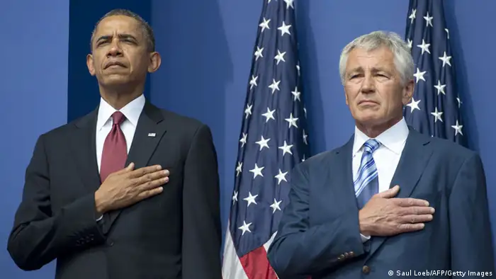 US President Barack Obama(L) and US Secretary of Defense Chuck Hagel stand for the American National Anthem during a ceremony to commemorate the 60th anniversary of the signing of the Armistice that ended the Korean War, at the Korean War Veterans Memorial in Washington, DC, July 27, 2013. AFP PHOTO / Saul LOEB (Photo credit should read SAUL LOEB/AFP/Getty Images)