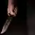 Symbolbild Mann mit Messer