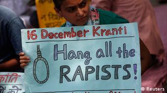 A demonstrator holds a placard during a protest against the verdict of a teenager, who was sentenced to three years in juvenile detention, in New Delhi September 1, 2013. (Photo: Reuters)