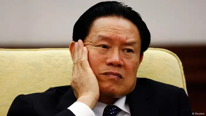 Then China's Public Security Minister Zhou Yongkang reacts as he attends the Hebei delegation discussion sessions at the 17th National Congress of the Communist Party of China at the Great Hall of the People, in Beijing October 16, 2007. Few figures are as divisive in China as former domestic security tsar Zhou, reportedly under investigation by the ruling Communist Party for corruption. Even the once ambitious but now ousted politician Bo Xilai, whose trial on corruption ended on August 26, 2013, doesn't evoke the same depth of feeling that Zhou does. From the oil fields of frigid northeastern China, the hulking Zhou worked his way up to the elite Politburo Standing Committee, where his spending on domestic security exceeded the separate budgets for defence, healthcare or education. Picture taken October 16, 2007. To match story CHINA-POLITICS/ZHOU REUTERS/Jason Lee (CHINA - Tags: POLITICS CRIME LAW)