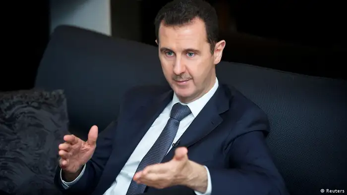 Syria's president Bashar al-Assad gestures during an interview with French daily Le Figaro in Damascus in this handout distributed by Syria's national news agency SANA on September 2, 2013. REUTERS/SANA/Handout (SYRIA - Tags: CONFLICT CIVIL UNREST POLITICS ) ATTENTION EDITORS - THIS IMAGE WAS PROVIDED BY A THIRD PARTY. FOR EDITORIAL USE ONLY. NOT FOR SALE FOR MARKETING OR ADVERTISING CAMPAIGNS. THIS PICTURE IS DISTRIBUTED EXACTLY AS RECEIVED BY REUTERS, AS A SERVICE TO CLIENTS