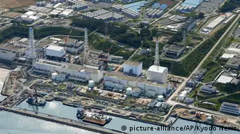 This aerial photo taken on Aug. 31, 2013, shows the Fukushima Dai-ichi nuclear plant at Okuma in Fukushima prefecture, northern Japan. Japan will fund some of the costly, long-term projects to control the worrisome and growing leaks of contaminated water at the crippled Fukushima nuclear plant. Public funding is part of several measures the government adopted Tuesday, Sept. 3, 2013. (AP Photo/Kyodo News) JAPAN OUT, MANDATORY CREDIT