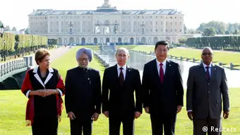 Brazil's President Dilma Rousseff, India's Prime Minister Manmohan Singh, Russia's President Vladimir Putin, China's President Xi Jinping and South African President Jacob Zuma (L-R) pose for a picture after a BRICS leaders' meeting at the G20 Summit in Strelna near St. Petersburg, September 5, 2013. REUTERS/Sergei Karpukhin (RUSSIA - Tags: POLITICS)