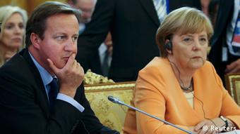 Премьер Великобритании Кэмерон и канцлер ФРГ Меркель следят за дискуссией на заседании двадцатки