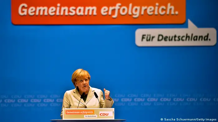 DUSSELDORF, GERMANY - SEPTEMBER 08: German Chancellor and Chairwoman of the German Christian Democrats (CDU) Angela Merkel gives a speech at the first election campaign rally in the final phase of campaigning on September 8, 2013 in Dusseldorf, Germany. Germany is facing federal elections scheduled for September 22 and so far Merkel and the CDU have a strong lead in polls over the opposition. (Photo by Sascha Schuermann/Getty Images)