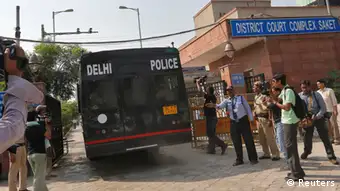 A police vehicle carrying four men accused of the gang rape of a 23-year-old woman on a bus on December 16, enters a court in New Delhi September 10, 2013. In one of the most highly anticipated verdicts in Indian legal history, a judge will rule on Tuesday whether four men are guilty of raping a woman on a bus in New Delhi and also murdering her, a charge that could see them hanged if convicted. REUTERS/Adnan Abidi (INDIA - Tags: CRIME LAW)
