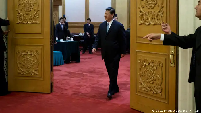 BEIJING, CHINA - JULY 18: Chinese President Xi Jinping walks out of a meeting room to shake hands with Swiss Federal President Ueli Maurer before their meeting at the Great Hall of the People on July 18, 2013 in Beijing, China. (Photo by Alexander F. Yuan - Pool/Getty Images)